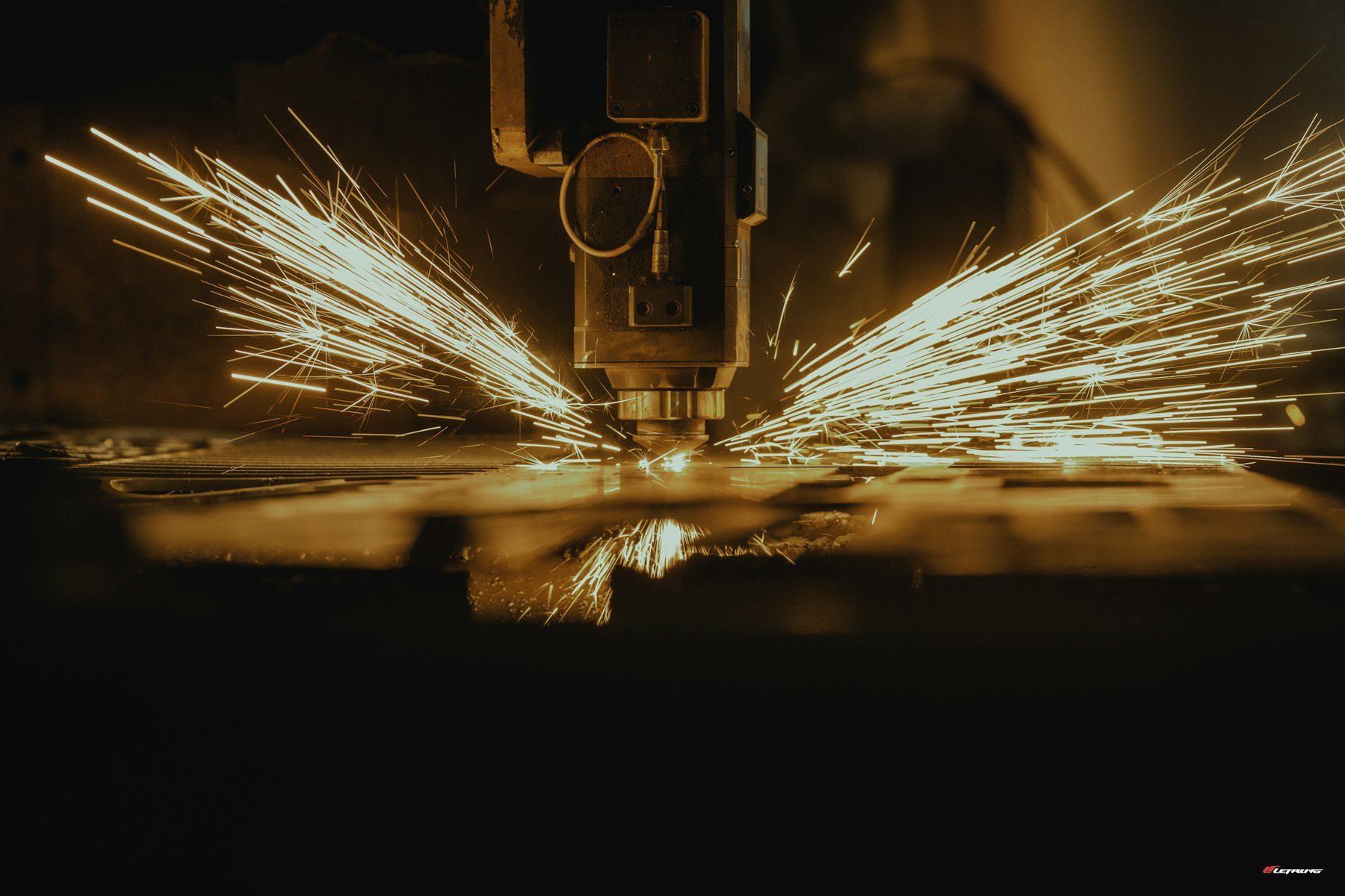 CNC precision machining with sparks from aerospace metal cutting
